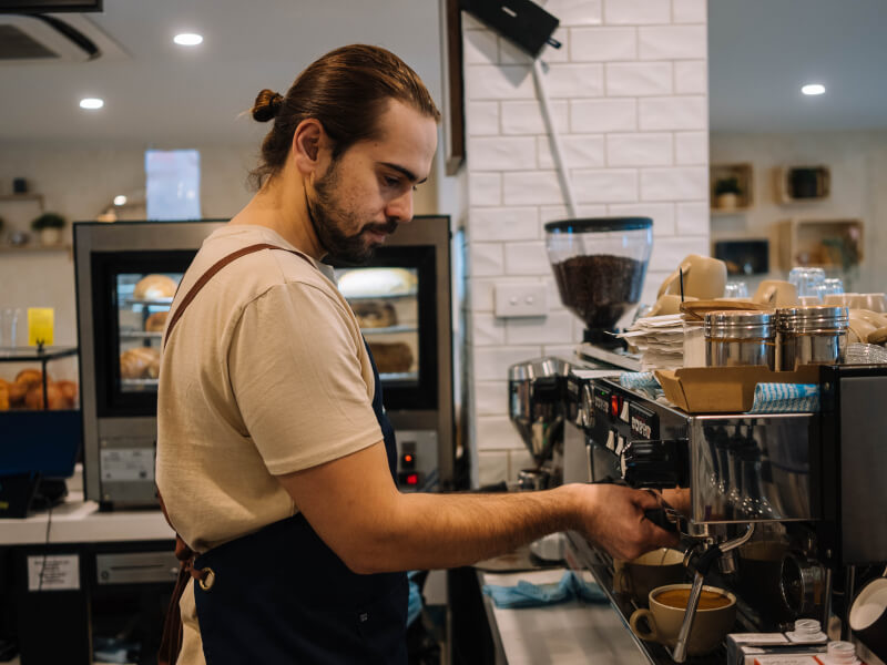 barista at espresso machine